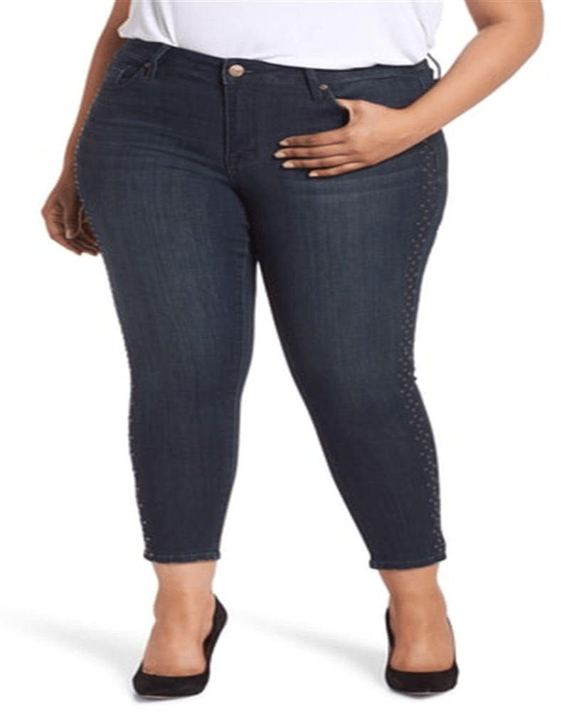 Front of a model wearing a size 24W Seven Dials Women's Trendy Studded Skinny Jeans Blue 24W in Blue by Seven Dials. | dia_product_style_image_id:308318